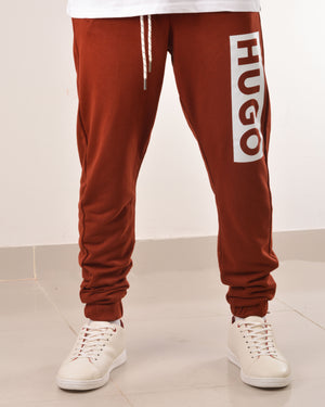 HUGO COTTON-TERRY TRACKSUIT BOTTOMS WITH LOGO PRINT MAROON